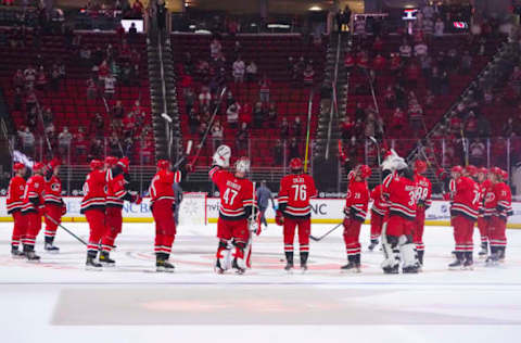 Mar 7, 2021; Raleigh, North Carolina, USA; Carolina Hurricanes players celebrate their win against the Florida Panthers at PNC Arena. Mandatory Credit: James Guillory-USA TODAY Sports