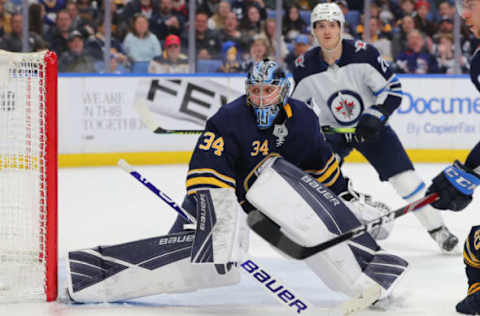 BUFFALO, NY – FEBRUARY 23: Jonas Johansson #34 of the Buffalo Sabres looks for the puck behind the net during the third period against the Winnipeg Jets at KeyBank Center on February 23, 2020 in Buffalo, New York. Buffalo beats Winnipeg 2 to 1. (Photo by Timothy T Ludwig/Getty Images)