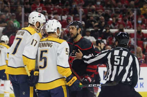 RALEIGH, NC – MAY 25: Nino Niederreiter #21 of the Carolina Hurricanes fights with players for the Nashville Predators in Game Five of the First Round of the 2021 Stanley Cup Playoffs at the PNC Arena on May 25, 2021, in Raleigh, North Carolina. (Photo by Jenna Miller/Getty Images)