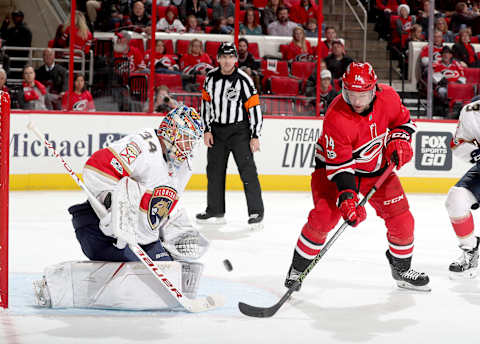 RALEIGH, NC – DECEMBER 2: Justin Williams #14 of the Carolina Hurricanes tries to flip the puck past James Reimer #34 of the Florida Panthers during an NHL game on December 2, 2017 at PNC Arena in Raleigh, North Carolina. (Photo by Gregg Forwerck/NHLI via Getty Images)