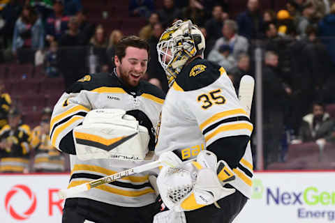 Feb 25, 2023; Vancouver, British Columbia, CAN; Boston Bruins goaltender Linus Ullmark (35) celebrates the win with goaltender Jeremy Swayman (1) after the third period at Rogers Arena. Mandatory Credit: Anne-Marie Sorvin-USA TODAY Sports