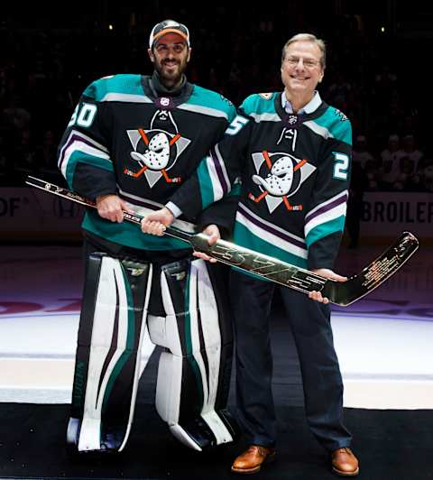 ANAHEIM, CA – MARCH 1: Ryan Miller #30 of the Anaheim Ducks is joined by Ducks owner, Henry Samueli as he is congratulated for being the NHL’s winningest US-born goaltender prior to the game against the Vegas Golden Knights on March 1, 2019, at Honda Center in Anaheim, California. (Photo by Debora Robinson/NHLI via Getty Images)