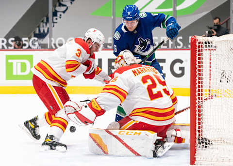 Brock Boeser of the Vancouver Canucks tries to score against the Calgary Flames (Photo by Rich Lam/Getty Images).