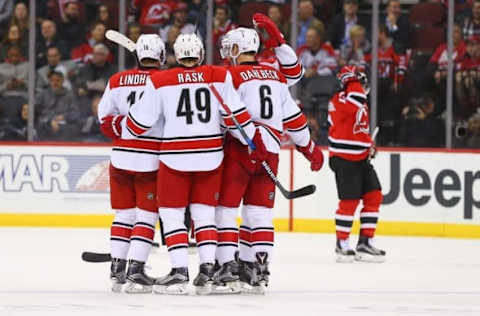 Nov 8, 2016; Newark, NJ, USA; The Carolina Hurricanes celebrate a goal by defenseman Klas Dahlbeck (6) during the second period of their game against the New Jersey Devils at Prudential Center. Mandatory Credit: Ed Mulholland-USA TODAY Sports