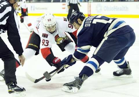 Feb 13, 2016; Columbus, OH, USA; Ottawa Senators center Mika Zibanejad (93) and Columbus Blue Jackets center Brandon Dubinsky (17) battle to win a faceoff at Nationwide Arena. Mandatory Credit: Greg Bartram-USA TODAY Sports