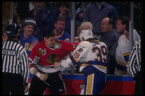 1991: A fight between Kelly Chase #39 of the St. Louis Blues and Stu Grimson #23 of the Chicago Blackhawks during their game at St. Louis Arena in St. Louis, Missouri. Mandatory Credit: Allsport /Allsport