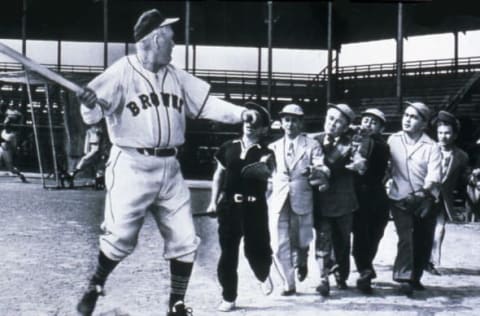 ST. LOUIS – CIRCA 1952: Hall of Famer Rogers Hornsby, manager of the St. Louis Browns pretends to fend off a group of Brownies, or little people, at a photo op at Sportsmans Park in St. Louis, Missouri in 1952. (Photo Reproduction by Transcendental Graphics/Getty Images)