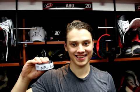 RALEIGH, NC – NOVEMBER 12: Sebastian Aho #20 of the Carolina Hurricanes scores his first NHL goal against the Washington Capitals during an NHL game on November 12, 2016 at PNC Arena in Raleigh, North Carolina. (Photo by Gregg Forwerck/NHLI via Getty Images)