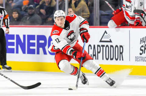 LAVAL, QC, CANADA – DECEMBER 28: Julien Gauthier #12 of the Charlotte Checkers in control of the puck shifts sides against the Laval Rocket at Place Bell on December 28, 2018 in Laval, Quebec. (Photo by Stephane Dube /Getty Images)