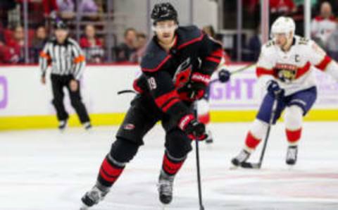 RALEIGH, NC – NOVEMBER 23: Carolina Hurricanes Defenceman Dougie Hamilton (19) carries the puck up ice during an NHL game between the Florida Panthers and the Carolina Hurricanes on November 23, 2019 at the PNC Arena in Raleigh, NC. (Photo by John McCreary/Icon Sportswire via Getty Images)