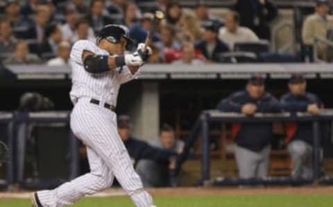 NEW YORK, NY – OCTOBER 06: Robinson Cano #24 of the New York Yankees hits a solo home run in the bottom of the fifht inning against the Detroit Tigers during Game Five of the American League Championship Series at Yankee Stadium on October 6, 2011 in the Bronx borough of New York City. (Photo by Nick Laham/Getty Images)