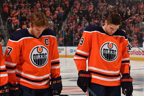 EDMONTON, AB – OCTOBER 24: Connor McDavid #97 and Leon Draisaitl #29 of the Edmonton Oilers stand for the singing of the national anthem prior to the game against the Washington Capitals on October 24, 2019, at Rogers Place in Edmonton, Alberta, Canada. (Photo by Andy Devlin/NHLI via Getty Images)