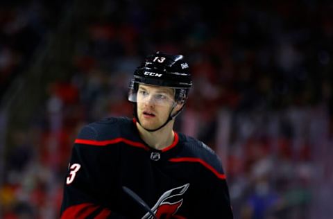 RALEIGH, NORTH CAROLINA – MAY 19: Warren Foegele #13 of the Carolina Hurricanes looks on during the first period in Game Two of the First Round of the 2021 Stanley Cup Playoffs against the Nashville Predators at PNC Arena on May 19, 2021, in Raleigh, North Carolina. (Photo by Jared C. Tilton/Getty Images)