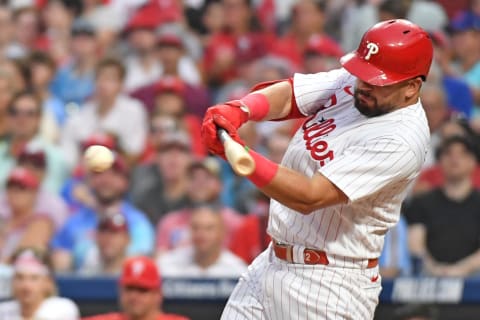 Jul 19, 2023; Philadelphia, Pennsylvania, USA; Philadelphia Phillies left fielder Kyle Schwarber (12) hits a two RBI single against the Milwaukee Brewers during the fifth inning at Citizens Bank Park. Mandatory Credit: Eric Hartline-USA TODAY Sports