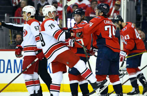 WASHINGTON, DC – APRIL 11: Washington Capitals defenseman John Carlson (74) shoves Carolina Hurricanes left wing Micheal Ferland (79) in the first period on April 11, 2019, at the Capital One Arena in Washington, D.C. in the first round of the Stanley Cup Playoffs. (Photo by Mark Goldman/Icon Sportswire via Getty Images)