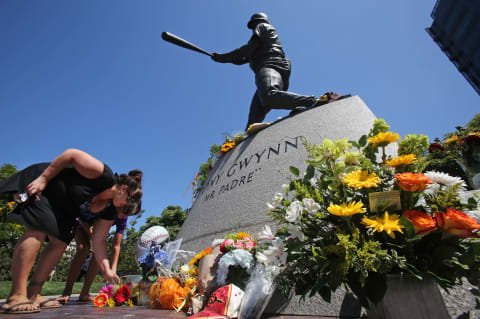 SAN DIEGO, CA – JUNE 16: Fans place flowers at the base of a statue of the late San Diego Padres great Tony Gwynn at Petco Park, where the Padres play, June 16, 2014 in San Diego, California. Gwynn died this morning after a lengthy battle with cancer, according to published reports. He was 54. (Photo by Bill Wechter/Getty Images)