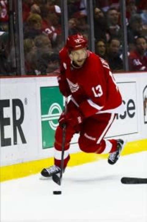 April 17, 2012; Detroit, MI, USA; Detroit Red Wings center Pavel Datsyuk (13) skates with the puck against the Nashville Predators in game four of the 2012 Western Conference quarterfinals at Joe Louis Arena. Mandatory Credit: Rick Osentoski-US PRESSWIRE