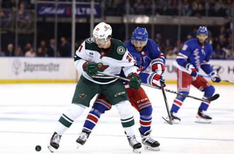 NEW YORK, NEW YORK – NOVEMBER 09: Brandon Duhaime #21 of the Minnesota Wild and Vincent Trocheck #16 of the New York Rangers fight for the puck during the second period at Madison Square Garden on November 09, 2023, in New York City. (Photo by Elsa/Getty Images)