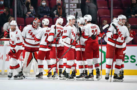 MONTREAL, QC – OCTOBER 21: The Carolina Hurricanes celebrate their victory against the Montreal Canadiens at Centre Bell on October 21, 2021, in Montreal, Canada. The Carolina Hurricanes defeated the Montreal Canadiens 4-1. (Photo by Minas Panagiotakis/Getty Images)