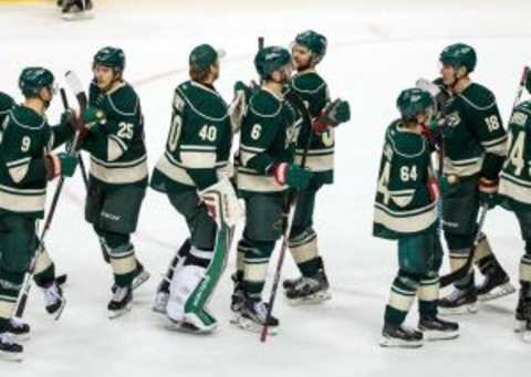 Dec 22, 2015; Saint Paul, MN, USA; The Minnesota Wild celebrate following the game against the Montreal Canadiens at Xcel Energy Center. The Wild defeated the Canadiens 3-1. Mandatory Credit: Brace Hemmelgarn-USA TODAY Sports