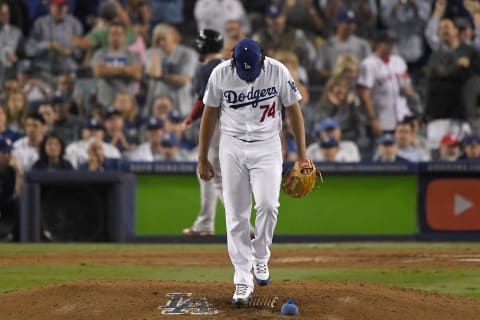 LOS ANGELES, CA – OCTOBER 27: Pitcher Kenley Jansen #74 of the Los Angeles Dodgers looks down at the mound after giving up a solo home run to tie the game at 4-4 to Steve Pearce #25 of the Boston Red Sox (on his way to home plate) in the eighth inning of Game Four of the 2018 World Series at Dodger Stadium on October 27, 2018 in Los Angeles, California. (Photo by Kevork Djansezian/Getty Images)