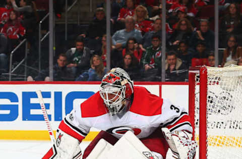 NEWARK, NJ – MARCH 25: Eddie Lack #31 of the Carolina Hurricanes defends his net against the New Jersey Devils during the game at Prudential Center on March 25, 2017 in Newark, New Jersey. (Photo by Andy Marlin/NHLI via Getty Images)