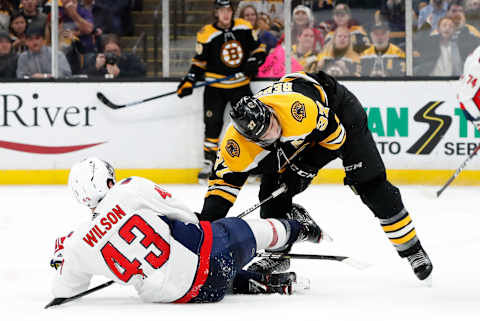 BOSTON, MA – JANUARY 10: Boston Bruins center Patrice Bergeron (37) takes Washington Capitals right wing Tom Wilson (43) down during a game between the Boston Bruins and the Washington Capitals on January 10, 2019, at TD Garden in Boston, Massachusetts. (Photo by Fred Kfoury III/Icon Sportswire via Getty Images)