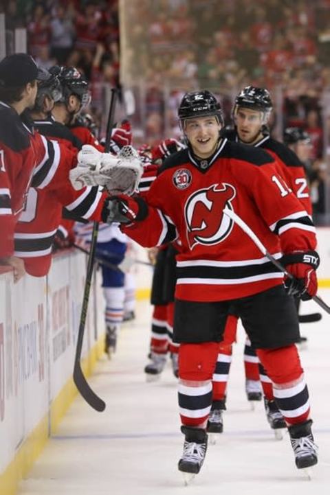 Feb 9, 2016; Newark, NJ, USA; New Jersey Devils center Reid Boucher (12) celebrates his goal during the third period at Prudential Center. The Devils defeated the Oilers 2-1. Mandatory Credit: Ed Mulholland-USA TODAY Sports