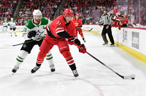 RALEIGH, NORTH CAROLINA – FEBRUARY 25: Blake Comeau #15 of the Dallas Stars defends Andrei Svechnikov #37 of the Carolina Hurricanes during the third period of their game at PNC Arena on February 25, 2020 in Raleigh, North Carolina. The Stars won 4-1. (Photo by Grant Halverson/Getty Images)