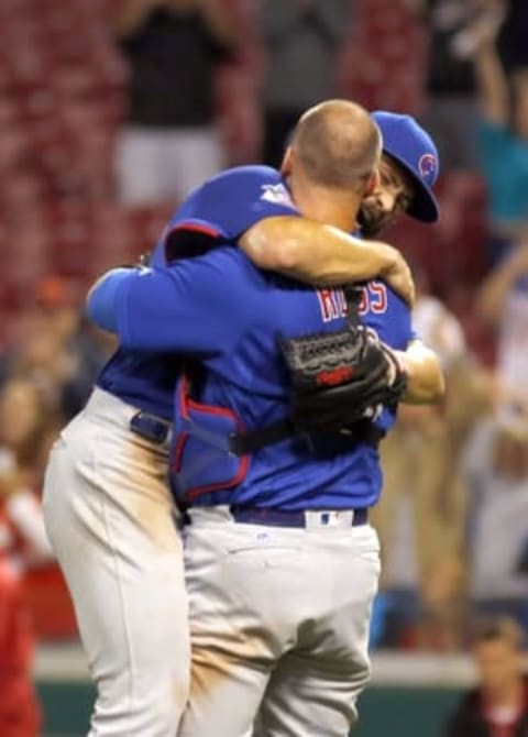 Apr 21, 2016; Cincinnati, OH, USA; Chicago Cubs starting pitcher Jake Arrieta (left) is congratulated by catcher David Ross (right) after Arrieta pitched a no-hitter against the Cincinnati Reds at Great American Ball Park. The Cubs won 16-0. Mandatory Credit: David Kohl-USA TODAY Sports