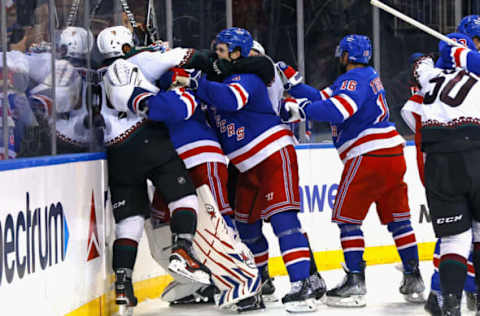 NEW YORK, NEW YORK – OCTOBER 16: Igor Shesterkin #31 of the New York Rangers wrestles with Matt Dumba #24 of the Arizona Coyotes at the end of the game at Madison Square Garden on October 16, 2023 in New York City. The Rangers defeated the Coyotes 2-1. (Photo by Bruce Bennett/Getty Images)