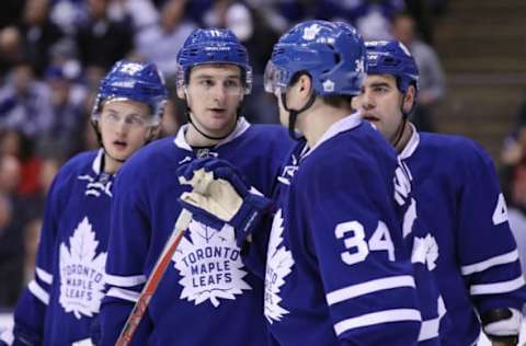 Feb 23, 2017; Toronto, Ontario, CAN; Toronto Maple Leafs center Zach Hyman (11) talks to center Auston Matthews (34) as center William Nylander (29) and defenseman Roman Polak (46) look on against the New York Rangers at Air Canada Centre. The Rangers beat the Maple Leafs 2-1 in the shootout. Mandatory Credit: Tom Szczerbowski-USA TODAY Sports