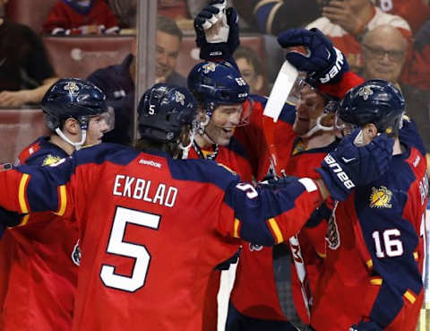 Dec 29, 2015; Sunrise, FL, USA; Florida Panthers right wing Jaromir Jagr (68) is congratulated after his goal against the Montreal Canadiens with defenseman Aaron Ekblad (5) center Aleksander Barkov (16) and defenseman Dmitry Kulikov (left) in the second period at BB&T Center. Mandatory Credit: Robert Mayer-USA TODAY Sports