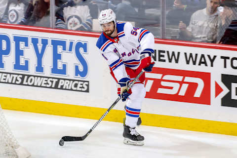 WINNIPEG, MB – FEBRUARY 12: Adam McQuaid #54 of the New York Rangers plays the puck behind the net during second period action against the Winnipeg Jets at the Bell MTS Place on February 12, 2019 in Winnipeg, Manitoba, Canada. (Photo by Jonathan Kozub/NHLI via Getty Images)