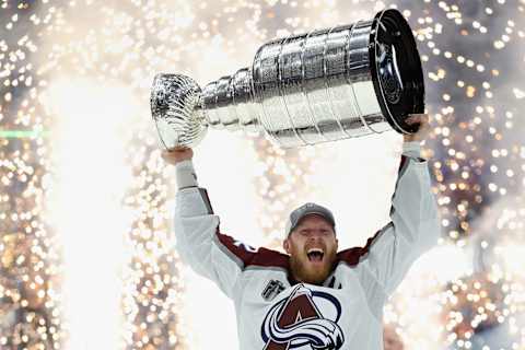 TAMPA, FLORIDA – JUNE 26: Gabriel Landeskog #92 of the Colorado Avalanche lifts the Stanley Cup in celebration after Game Six of the 2022 NHL Stanley Cup Final at Amalie Arena on June 26, 2022 in Tampa, Florida. The Avalanche defeated the Lightning 2-1. (Photo by Christian Petersen/Getty Images)