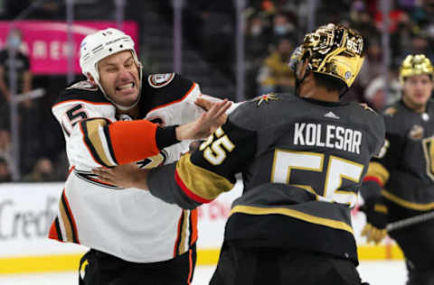 LAS VEGAS, NEVADA – DECEMBER 31: Ryan Getzlaf #15 of the Anaheim Ducks and Keegan Kolesar #55 of the Vegas Golden Knights fight in the second period of their game at T-Mobile Arena on December 31, 2021 in Las Vegas, Nevada. (Photo by Ethan Miller/Getty Images)