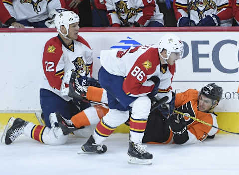 Oct 12, 2015; Philadelphia, PA, USA; Philadelphia Flyers center Chris VandeVelde (76) battles with Florida Panthers right wing Shawn Thornton (22) and center Connor Brickley (86) during the third period at Wells Fargo Center. The Flyers defeated the Panthers, 1-0. Mandatory Credit: Eric Hartline-USA TODAY Sports