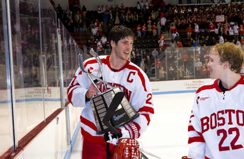 Doyle Somerby holds the regular season championship trophy with Boston University Terriers (Photo by Richard T Gagnon/Getty Images)