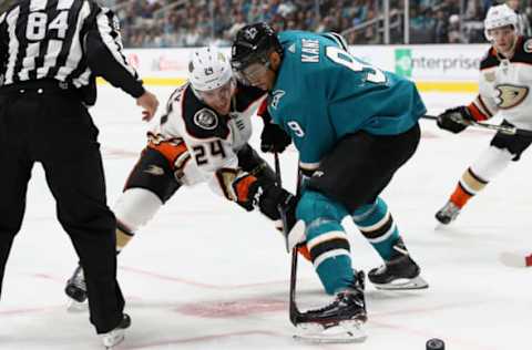 SAN JOSE, CA – OCTOBER 03: Carter Rowney #24 of the Anaheim Ducks and Evander Kane #9 of the San Jose Sharks go for the puck at SAP Center on October 3, 2018 in San Jose, California. (Photo by Ezra Shaw/Getty Images)