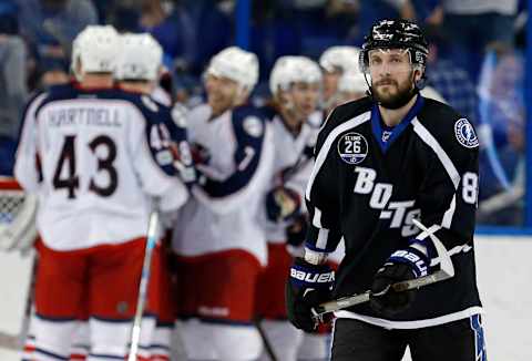 TAMPA, FL – JANUARY 13: Nikita Kucherov #86 of the Tampa Bay Lightning reacts as members of the Columbus Blue Jackets celebrate a win at the Amalie Arena on January 13, 2017 in Tampa, Florida. (Photo by Mike Carlson/Getty Images)