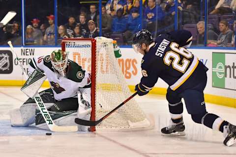 Feb 6, 2016; St. Louis, MO, USA; Minnesota Wild goalie Devan Dubnyk (40) blocks the shot of St. Louis Blues center Paul Stastny (26) during the second period at Scottrade Center. Mandatory Credit: Jasen Vinlove-USA TODAY Sports