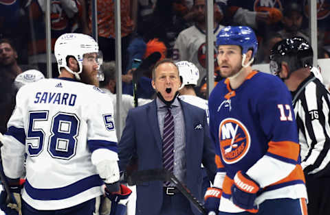 Head coach Jon Cooper of the Tampa Bay Lightning speaks with a referee. (Photo by Bruce Bennett/Getty Images)