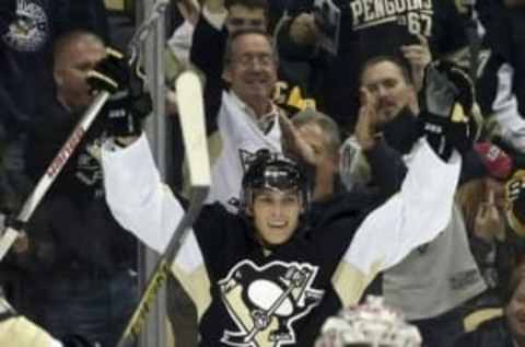 Oct 13, 2015; Pittsburgh, PA, USA; Pittsburgh Penguins right wing Beau Bennett (rear) celebrates scoring a goal against Montreal Canadiens goalie Carey Price (31) during the second period at the CONSOL Energy Center. Mandatory Credit: Charles LeClaire-USA TODAY Sports