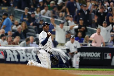 NEW YORK, NY – OCTOBER 3: Adeiny Hechavarria #29 of the New York Yankees holds up the ball after a leaping catch on a line drive by Marcus Semien #10 of the Oakland Athletics in the seventh inning during the American League Wild Card game at Yankee Stadium on Wednesday, October 3, 2018 in the Bronx borough of New York City. (Photo by Alex Trautwig/MLB Photos via Getty Images)