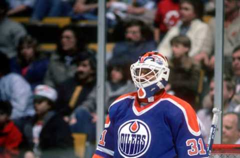 NEW YORK – CIRCA 1990: Grant Fuhr #1 of the Edmonton Oilers defends his goal against the New York Rangers during an NHL Hockey game circa 1990 at Madison Square Garden in the Manhattan borough of New York City. Fuhr’s playing career went from 1981-2000. (Photo by Focus on Sport/Getty Images)