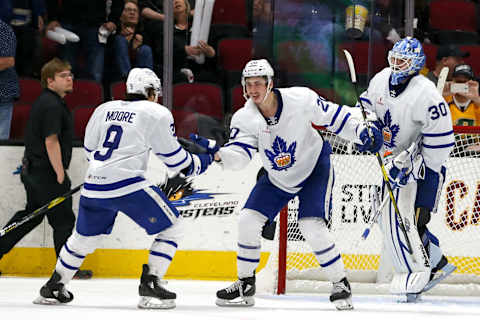 CLEVELAND, OH – MAY 05: Toronto Marlies left wing Trevor Moore (9) and Toronto Marlies left wing Mason Marchment (20) celebrate as Toronto Marlies goalie Kasimir Kaskisuo (30) looks on following the 2019 American Hockey League Calder Cup North Division Finals game 3 between the Toronto Marlies and Cleveland Monsters on May 5, 2019, at Rocket Mortgage FieldHouse in Cleveland, OH. Toronto defeated Cleveland 2-0. (Photo by Frank Jansky/Icon Sportswire via Getty Images)