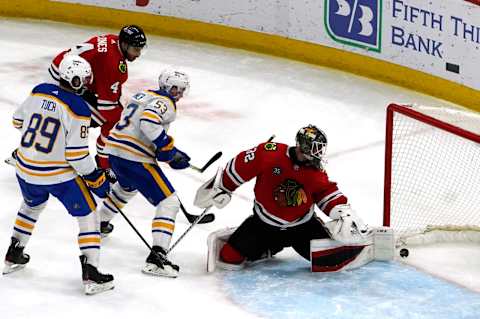 Mar 28, 2022; Chicago, Illinois, USA; Chicago Blackhawks goaltender Kevin Lankinen (32) can’t stop a goal that bounces off his skate against the Buffalo Sabres during the third period at United Center. Mandatory Credit: David Banks-USA TODAY Sports