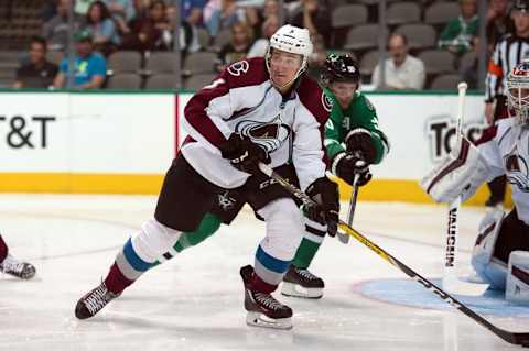 Oct 5, 2016; Dallas, TX, USA; Colorado Avalanche defenseman Chris Bigras (3) keeps the puck away from Dallas Stars center Jason Spezza (90) during the second period at the American Airlines Center. Mandatory Credit: Jerome Miron-USA TODAY Sports