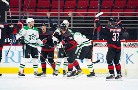 Jan 30, 2021; Raleigh, North Carolina, USA; Carolina Hurricanes center Vincent Trocheck (16) celebrates his first period goal against the Dallas Stars at PNC Arena. Mandatory Credit: James Guillory-USA TODAY Sports