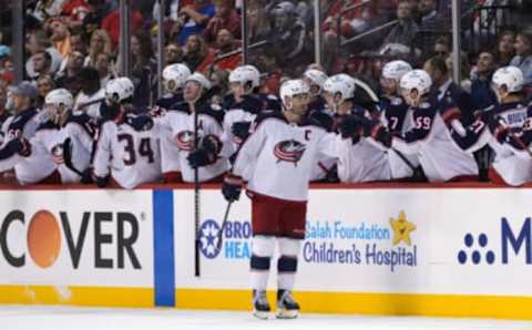 Feb 24, 2022; Sunrise, Florida, USA; Columbus Blue Jackets center Boone Jenner (38) celebrates his goal against the Florida Panthers with teammates on the bench during the second period at FLA Live Arena. Mandatory Credit: Jasen Vinlove-USA TODAY Sports